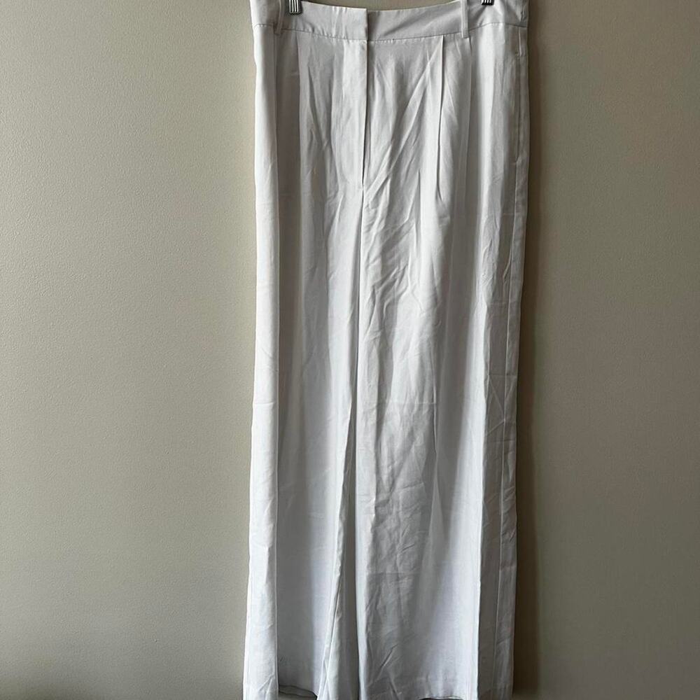 White pleated wide leg trousers